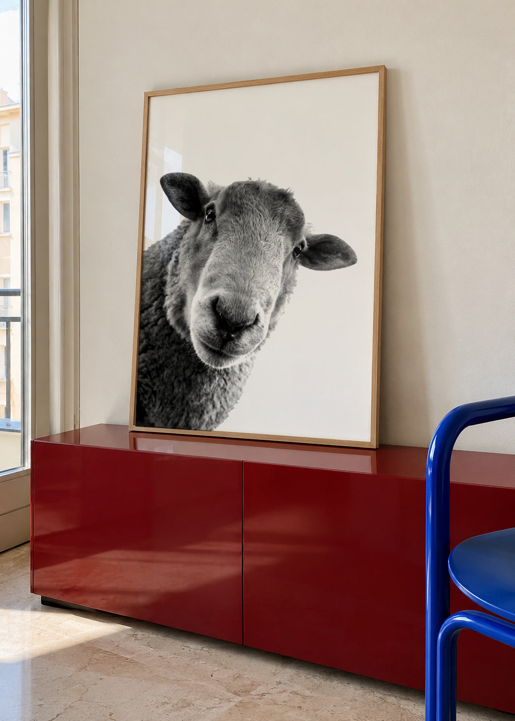 Curious sheep - Framed poster in an interior