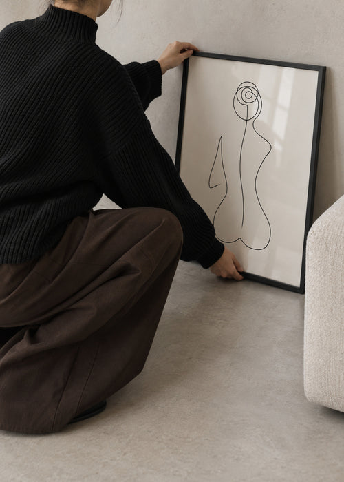 Sitting Beauty - Framed poster in an interior