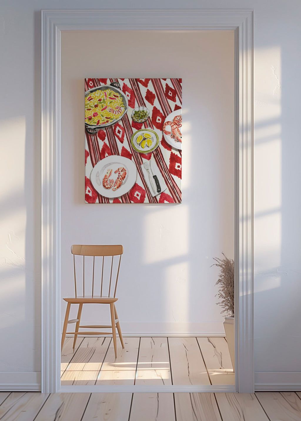 Kitchen art: paella and prawns on a patterned tablecloth