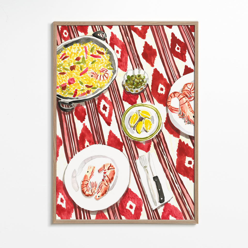 Kitchen art: paella and prawns on a patterned tablecloth