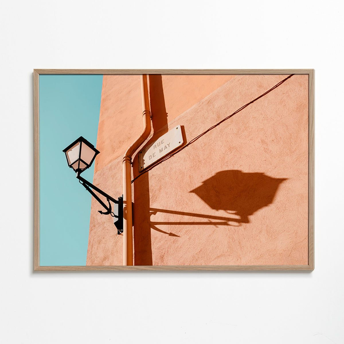 Travel poster with Rue de May lamp and shadow – Oak Frame