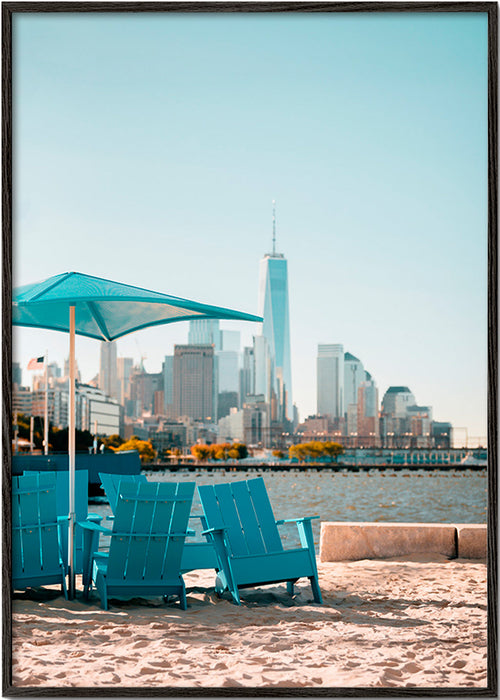 Travel poster with turquoise beach chairs and city skyline – Black Frame