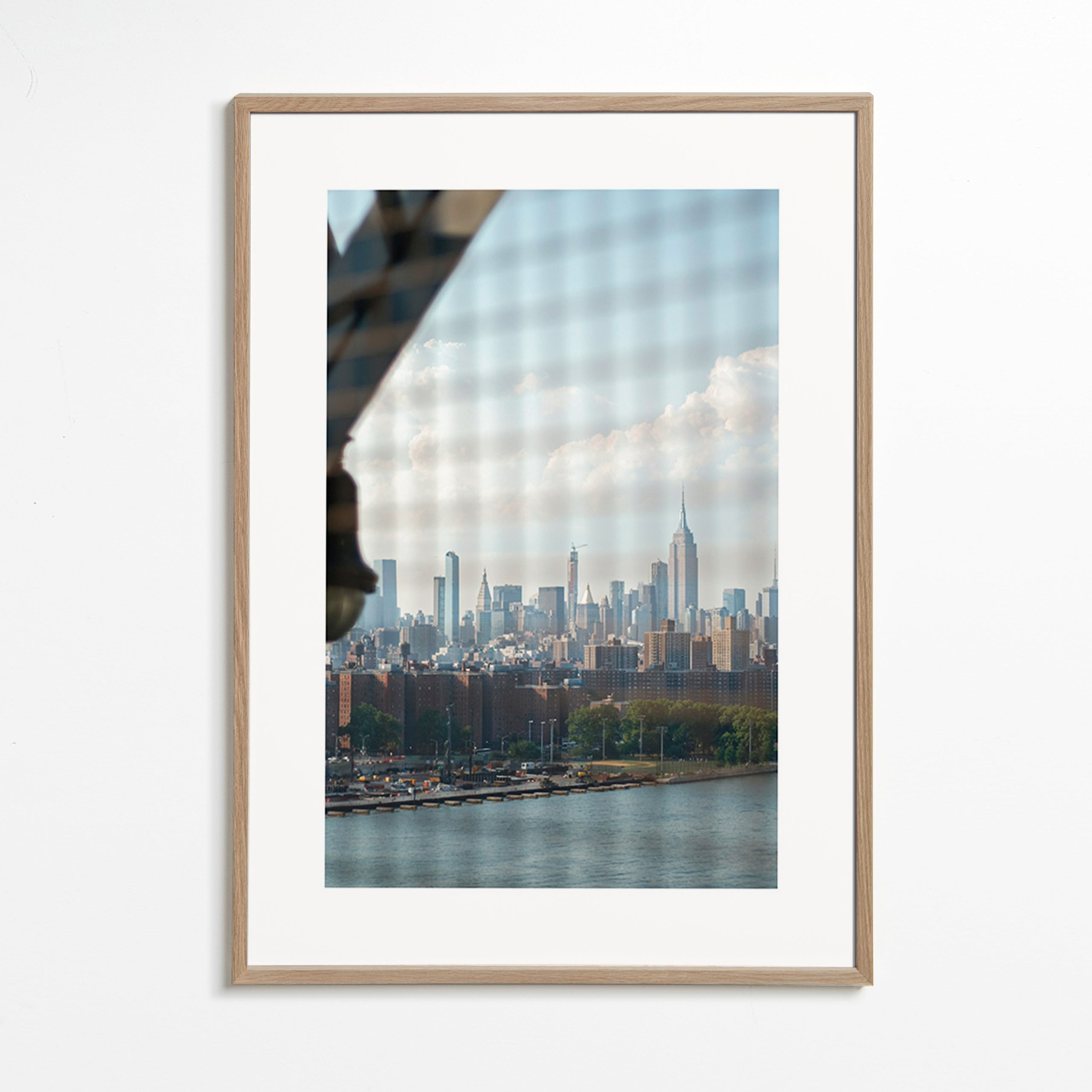 City print showing skyline through a window