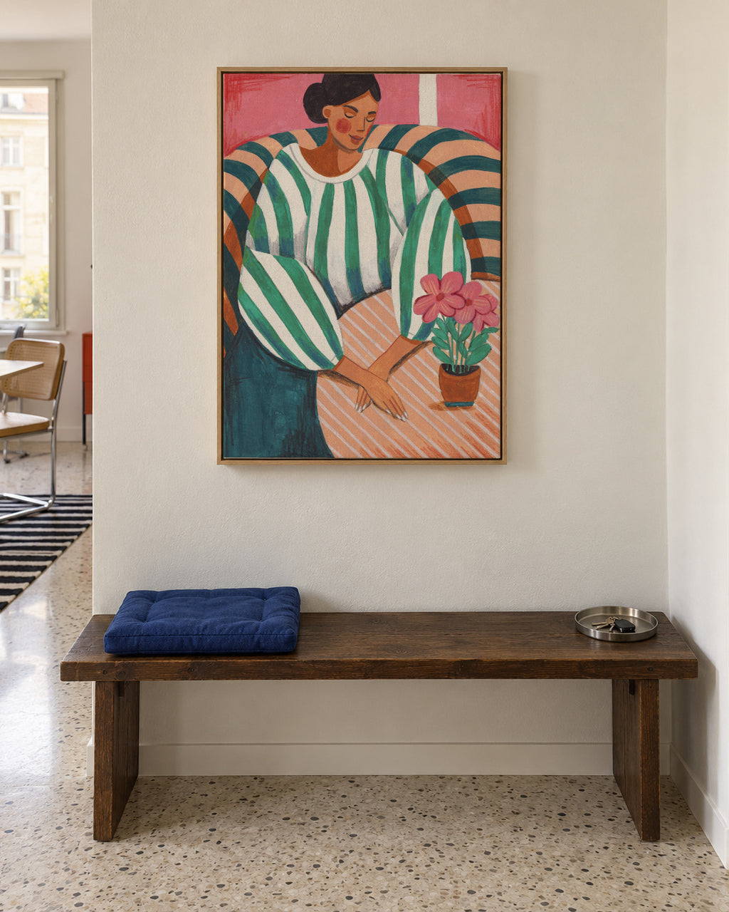 Woman in stripes in thought - Framed canvas in an interior