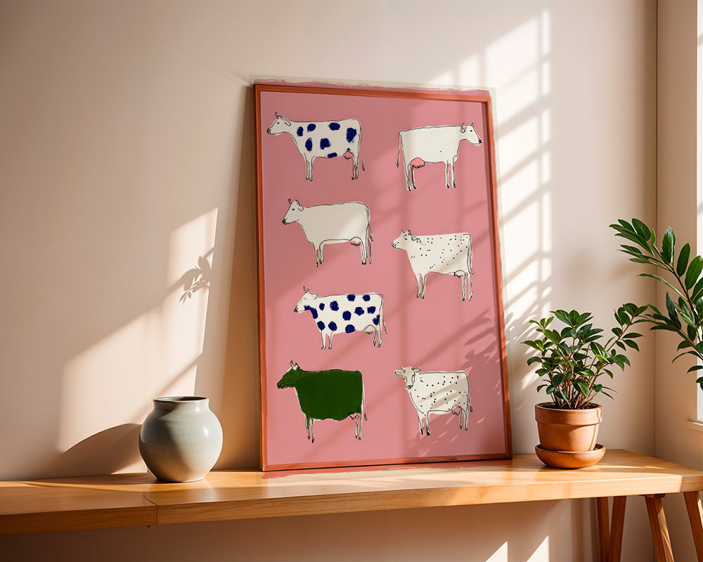 Artwork with playful cows on pink background