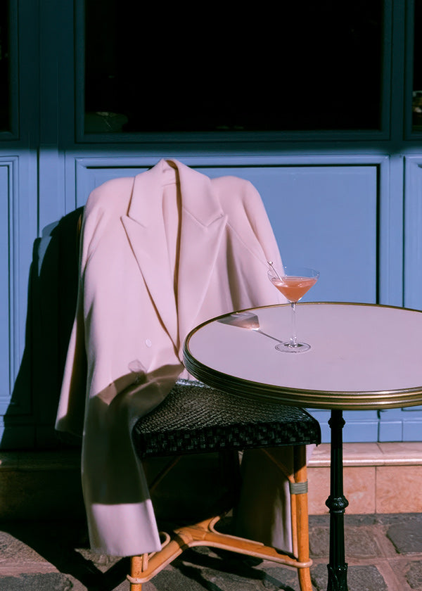 Photograph pink jacket and cocktail on terrace