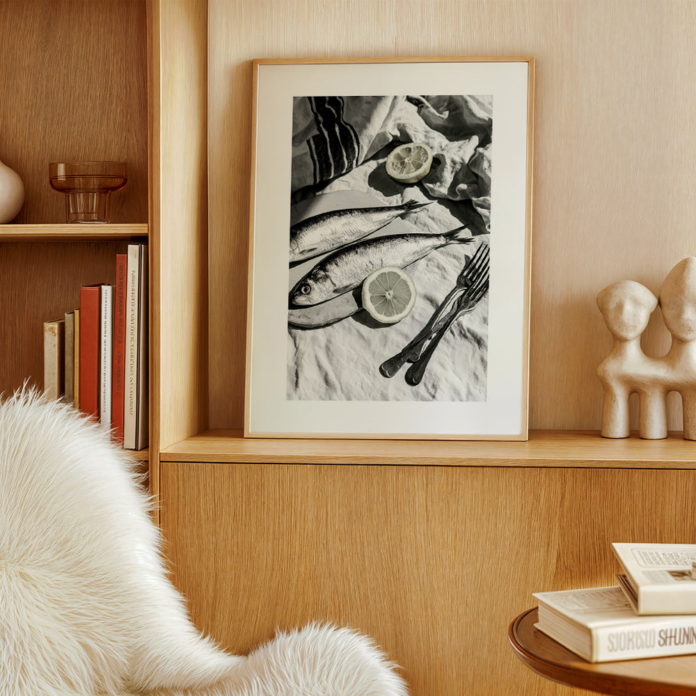 Kitchen art: monochrome sardines and lemon still life